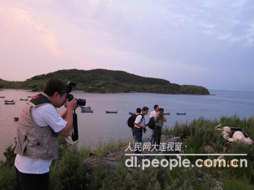 拍摄獐子岛日落风景的摄影家